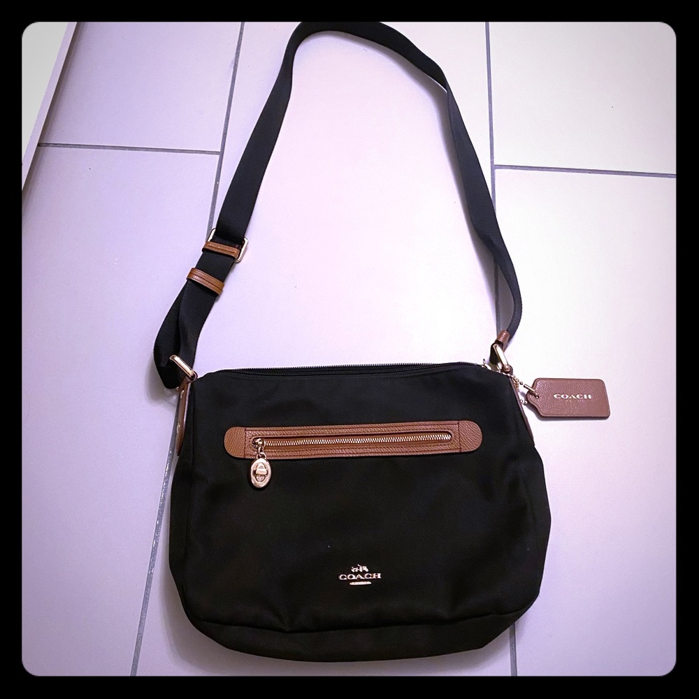 Black crossbody coach purse with brown and gold